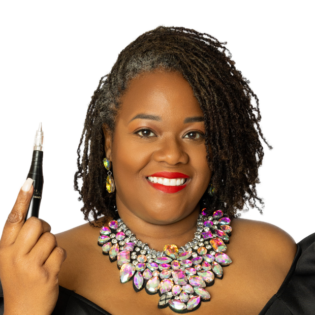 LaJoy Grant, master permanent makeup artist, holding a PMU machine