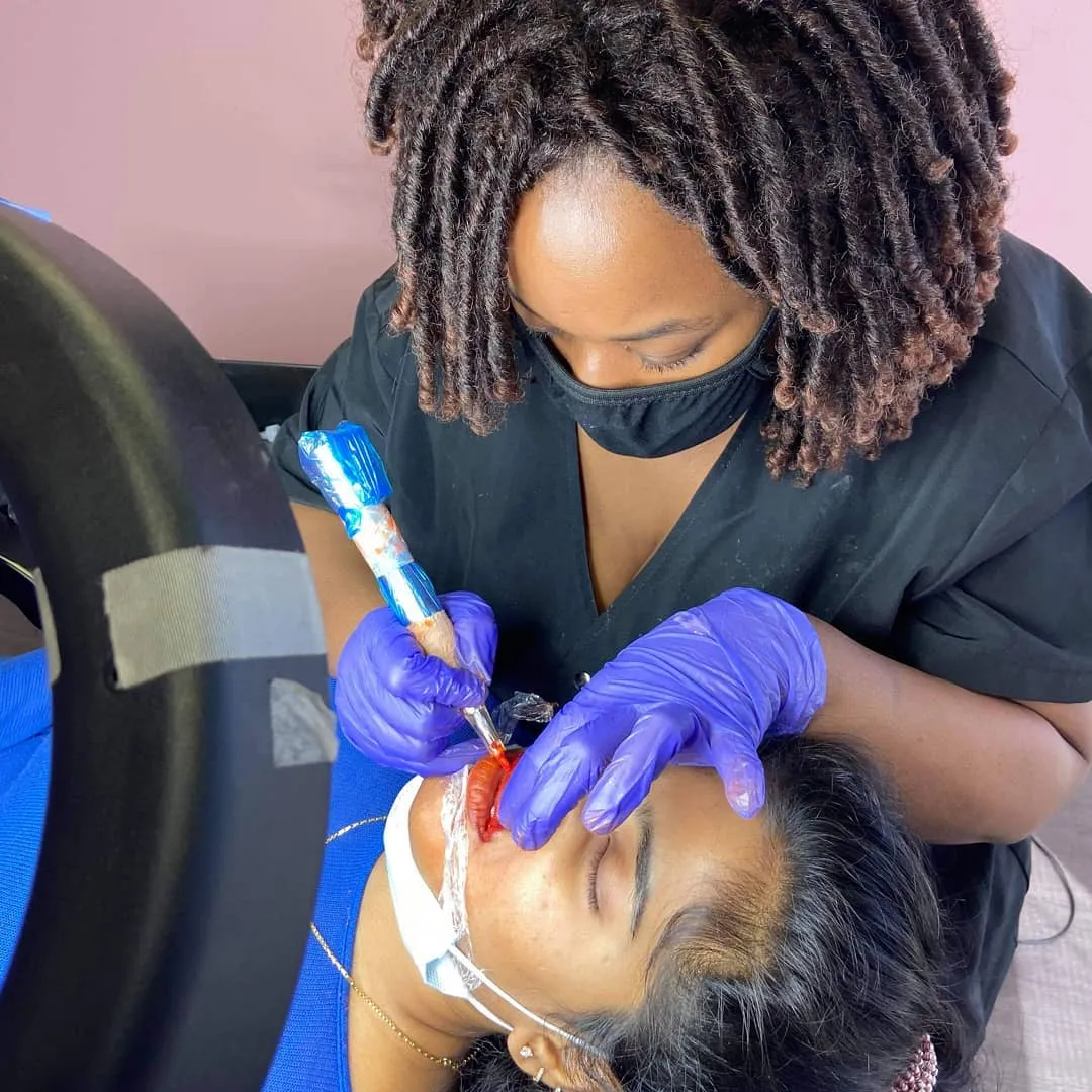 LaJoy Grant performing a lip blush procedure at LaBrows Beauty Studio